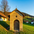 A quaint stone chapel basks in the sunsetÃ¢â¬â¢s glow Royalty Free Stock Photo